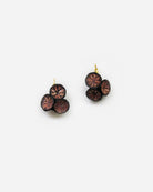 boucles d'oreilles en lurex roses et noires au design graphique