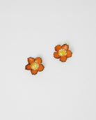 minis boucles d'oreilles fleurs en plastique oranges 