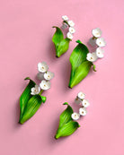 all-groups Broches bijoux fantaisie représentant des fleurs de muguet blanches