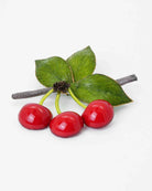 Broche cerises rouges avec feuilles vertes 